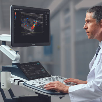 doctor looking at ultrasound machine