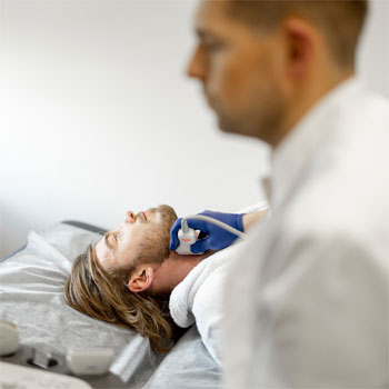 vascular ultrasound on man's neck